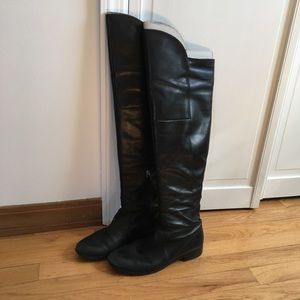 Black flat over the knee boots